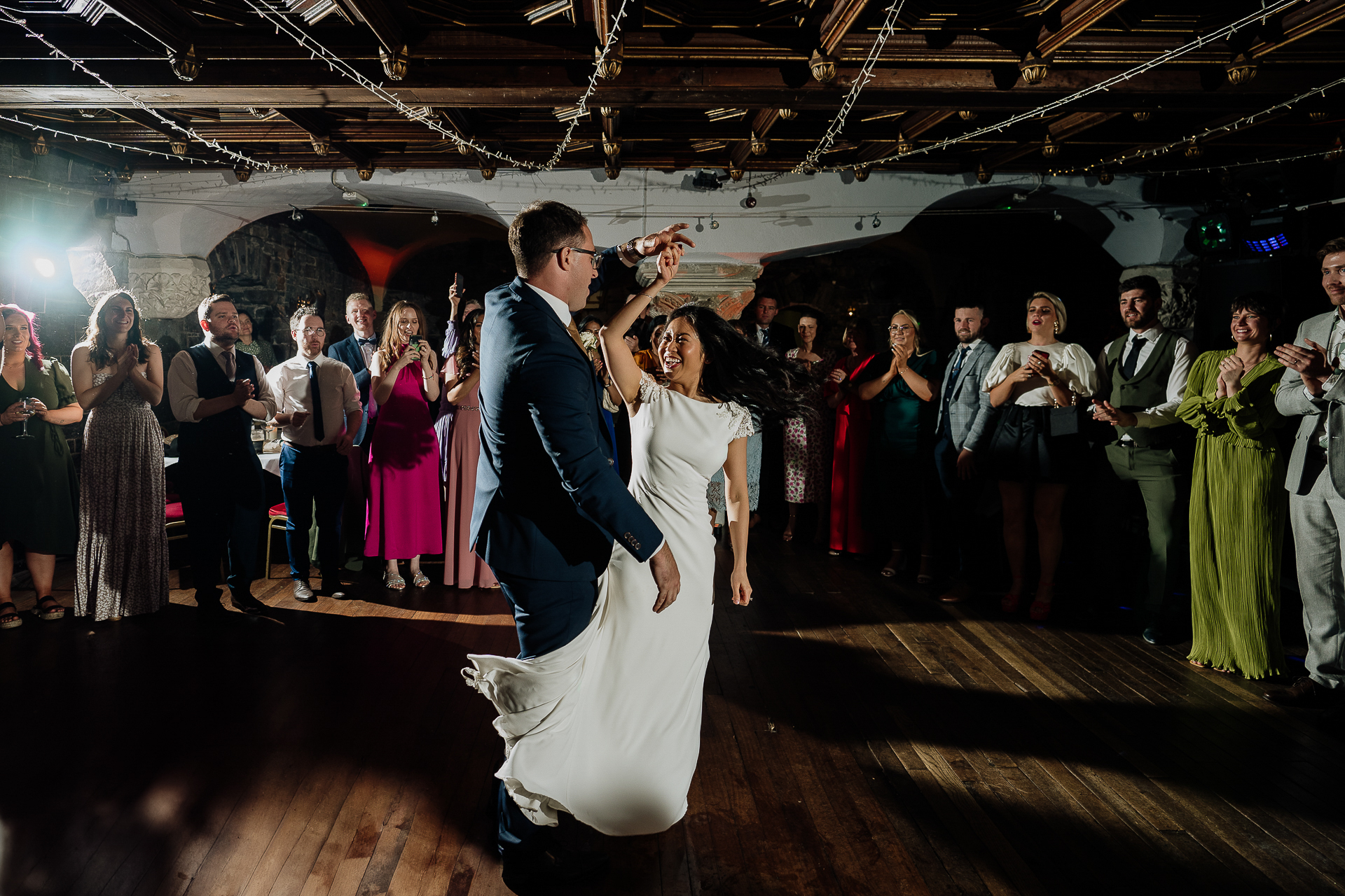 A man and woman dancing at a wedding reception