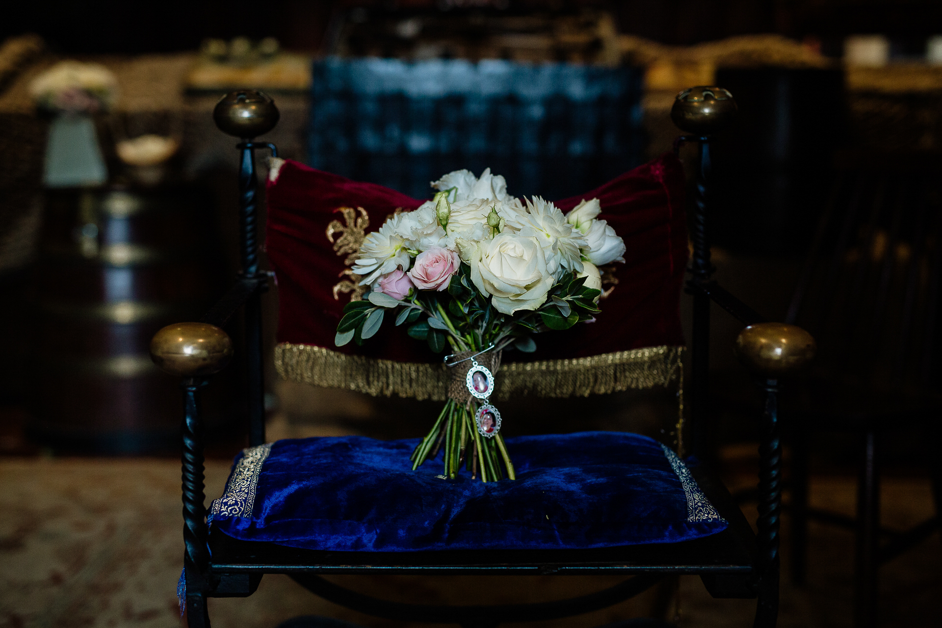 A vase of flowers on a chair