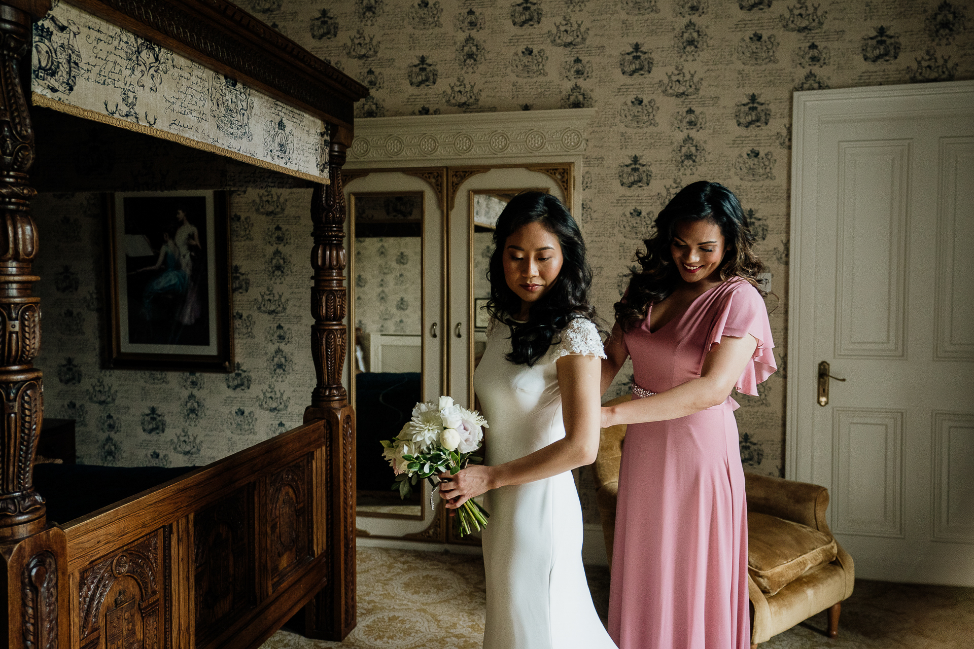 A woman in a white dress and a woman in a pink dress