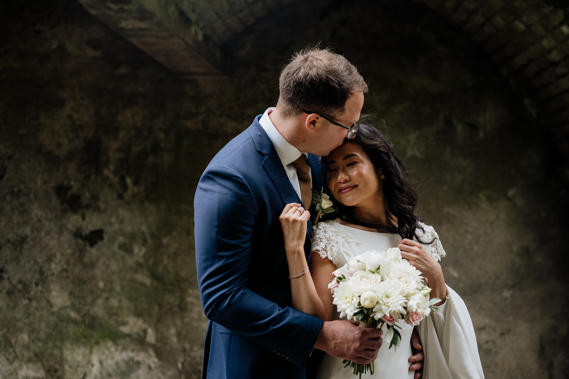 A man and woman holding flowers