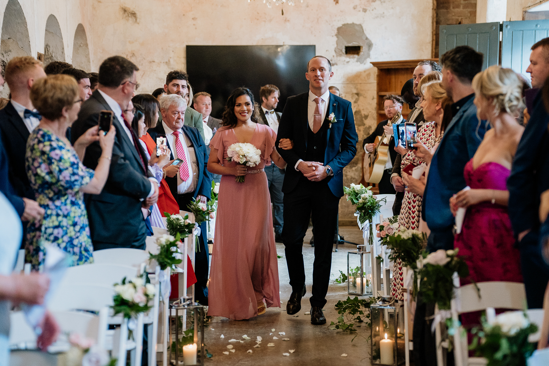 A man and woman walking down a aisle