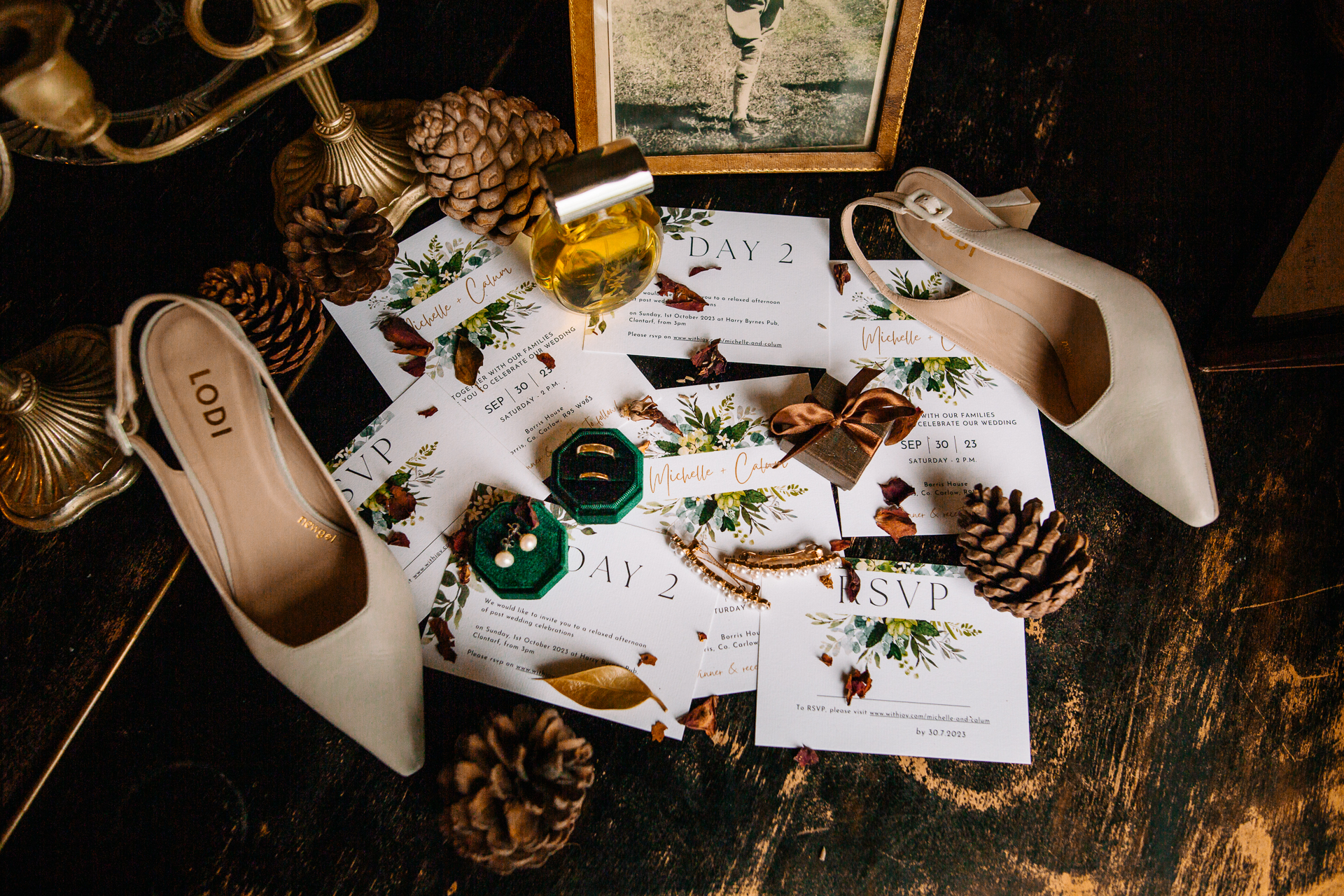 A pair of shoes and a bottle of alcohol on a table