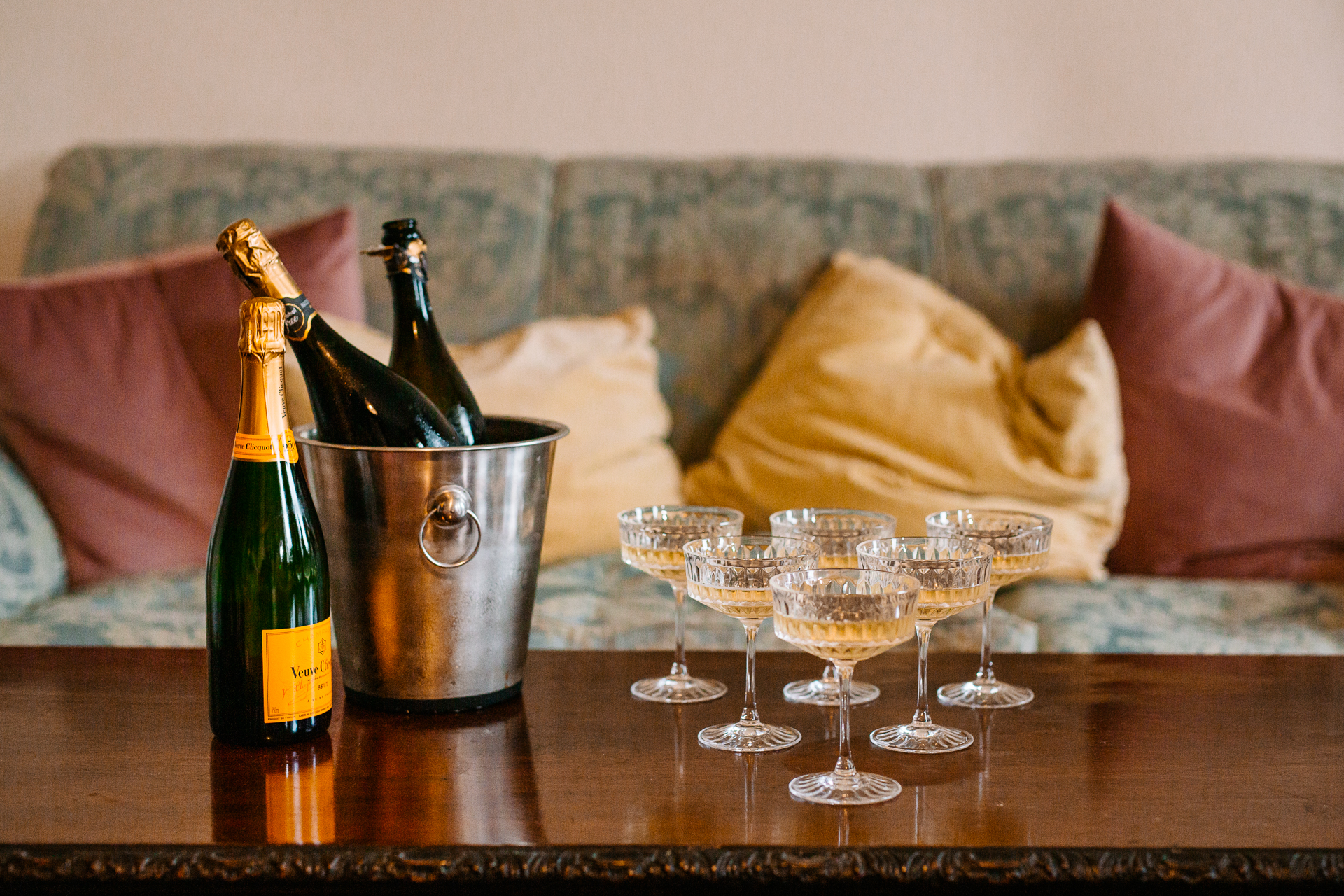 A bottle of wine and glasses on a table