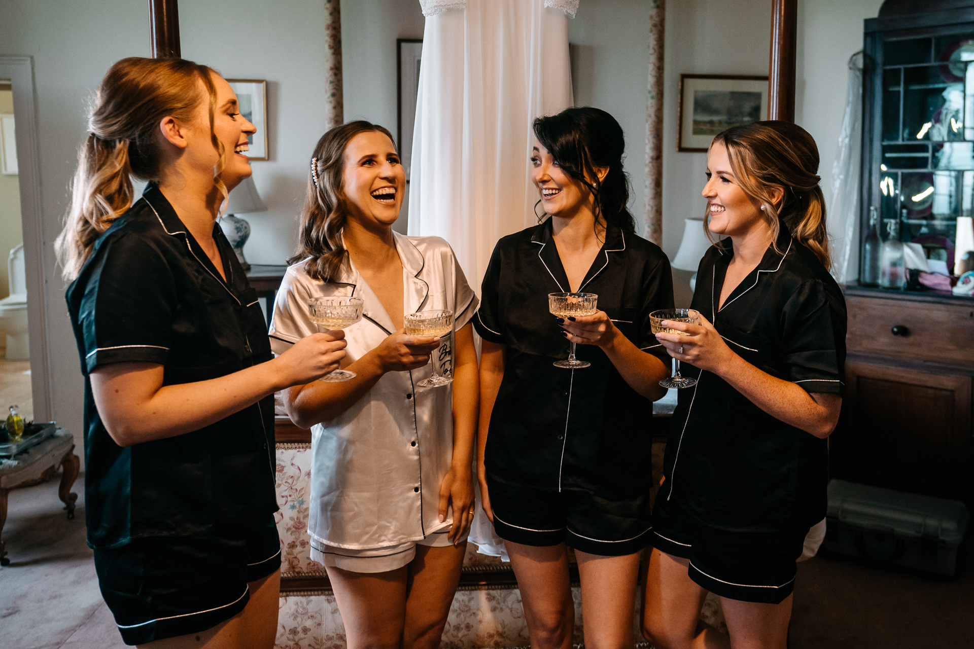 A group of women holding wine glasses