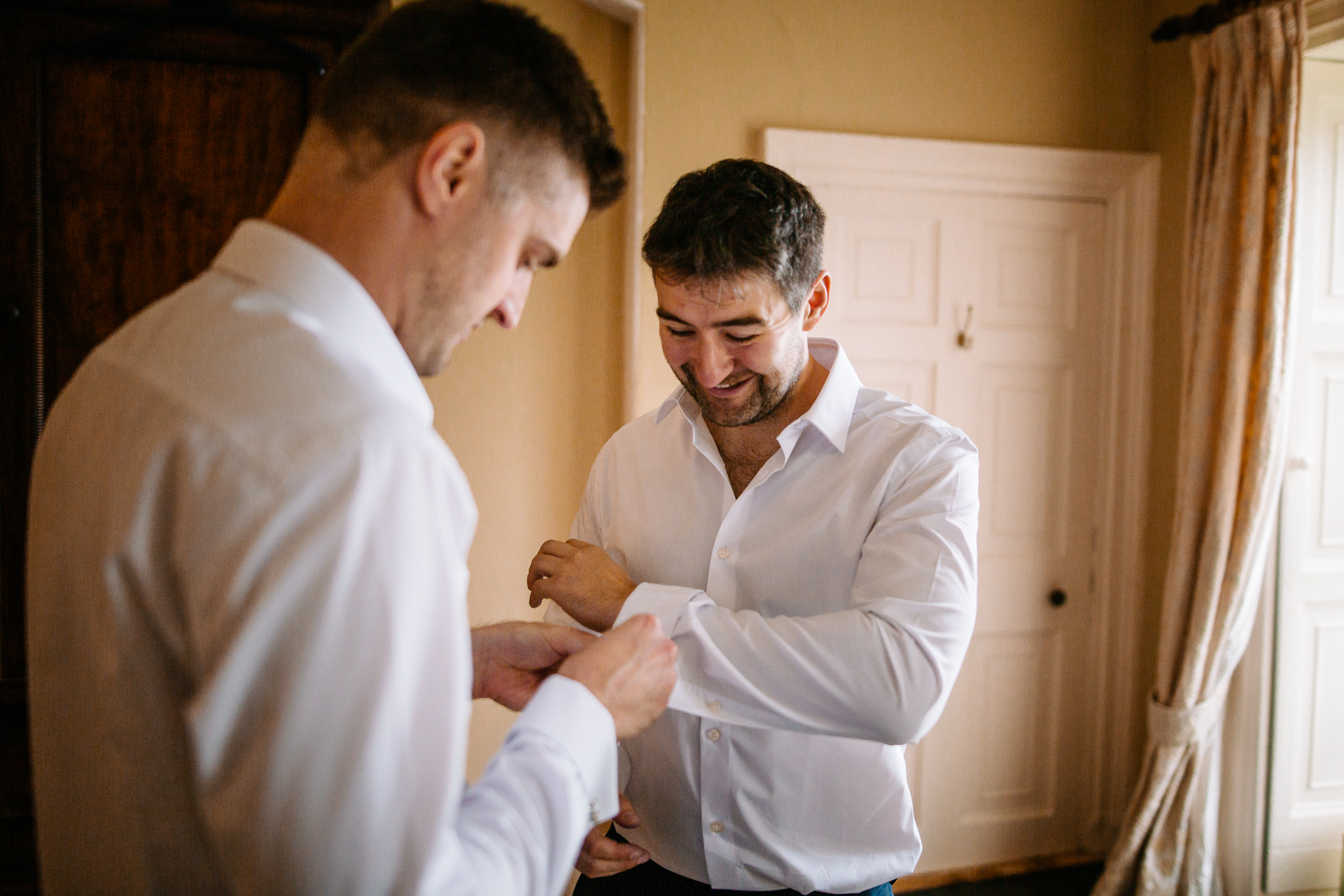 A man shaking another man's hand