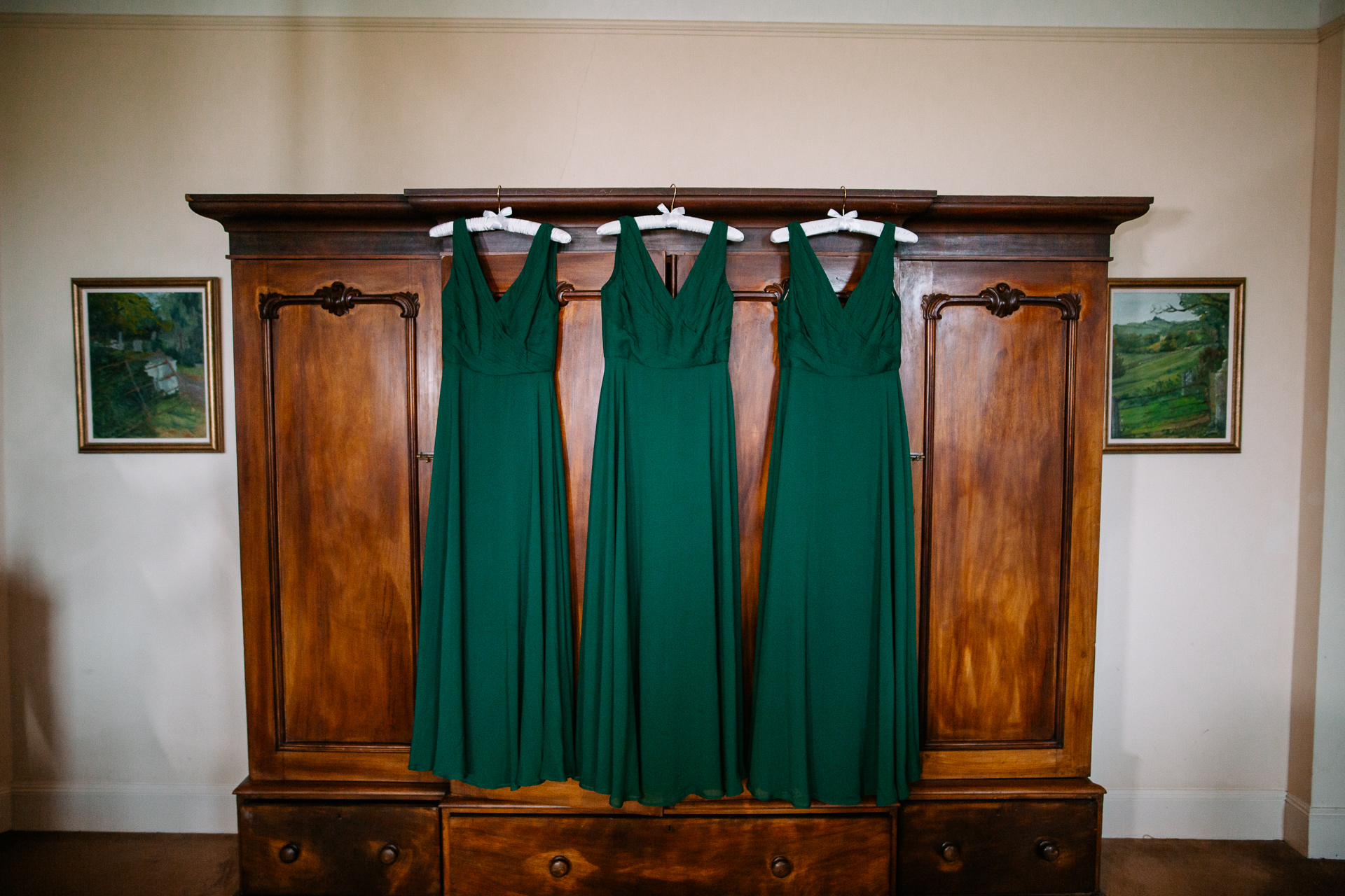 A wooden cabinet with a curtain