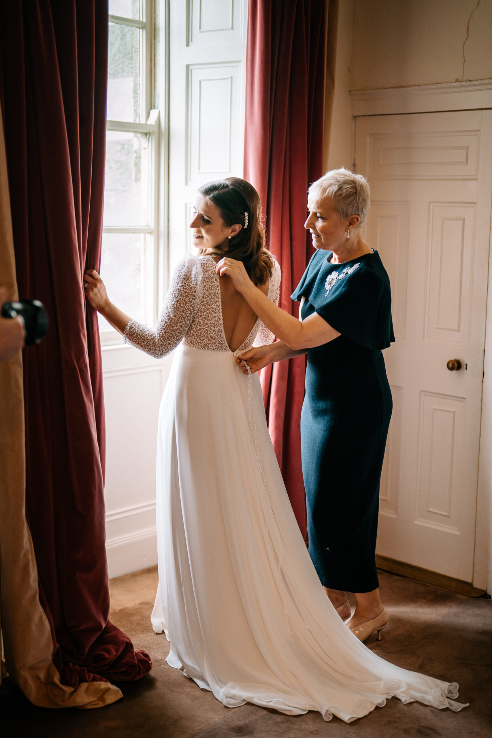 A woman in a white dress and a woman in a black dress