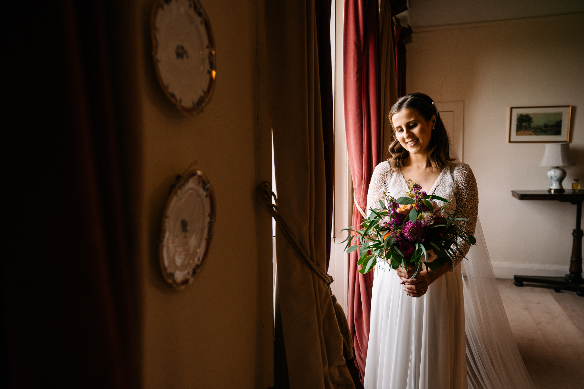 A person in a white dress holding a bouquet of flowers