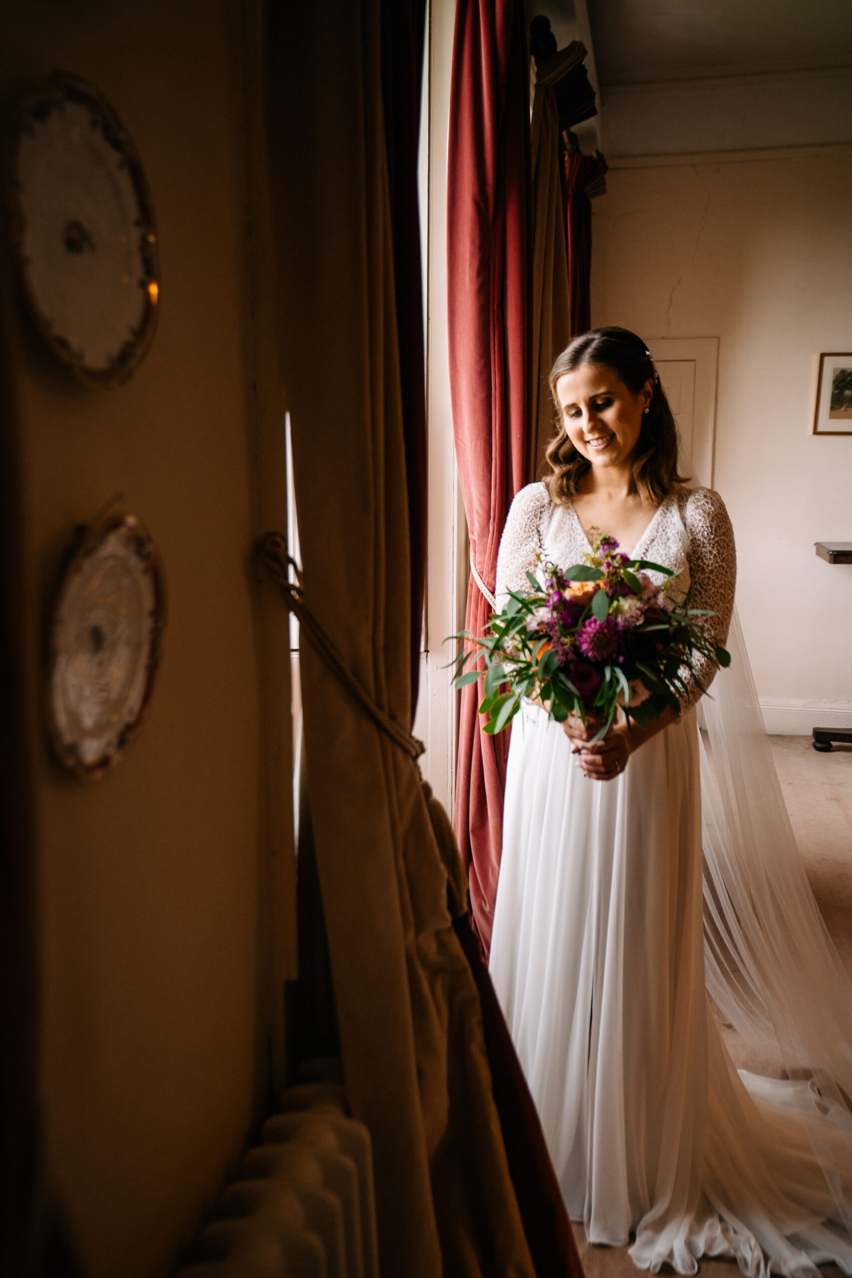 A person in a white dress holding a bouquet of flowers