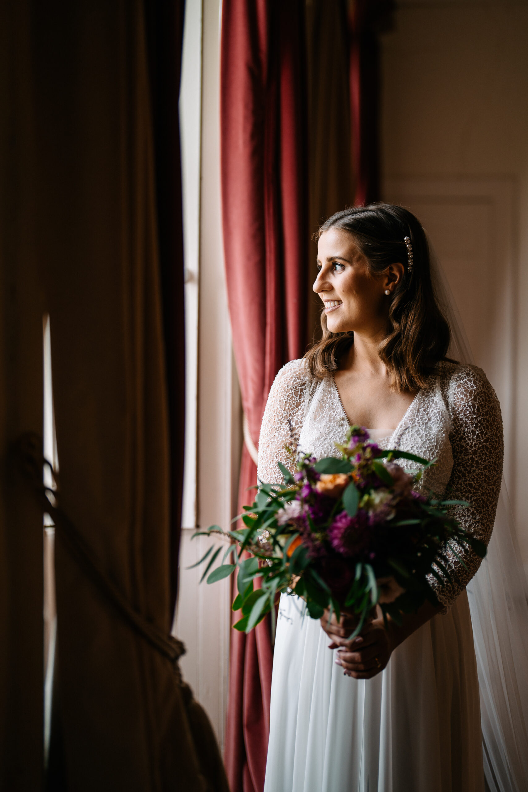 A woman in a dress holding flowers