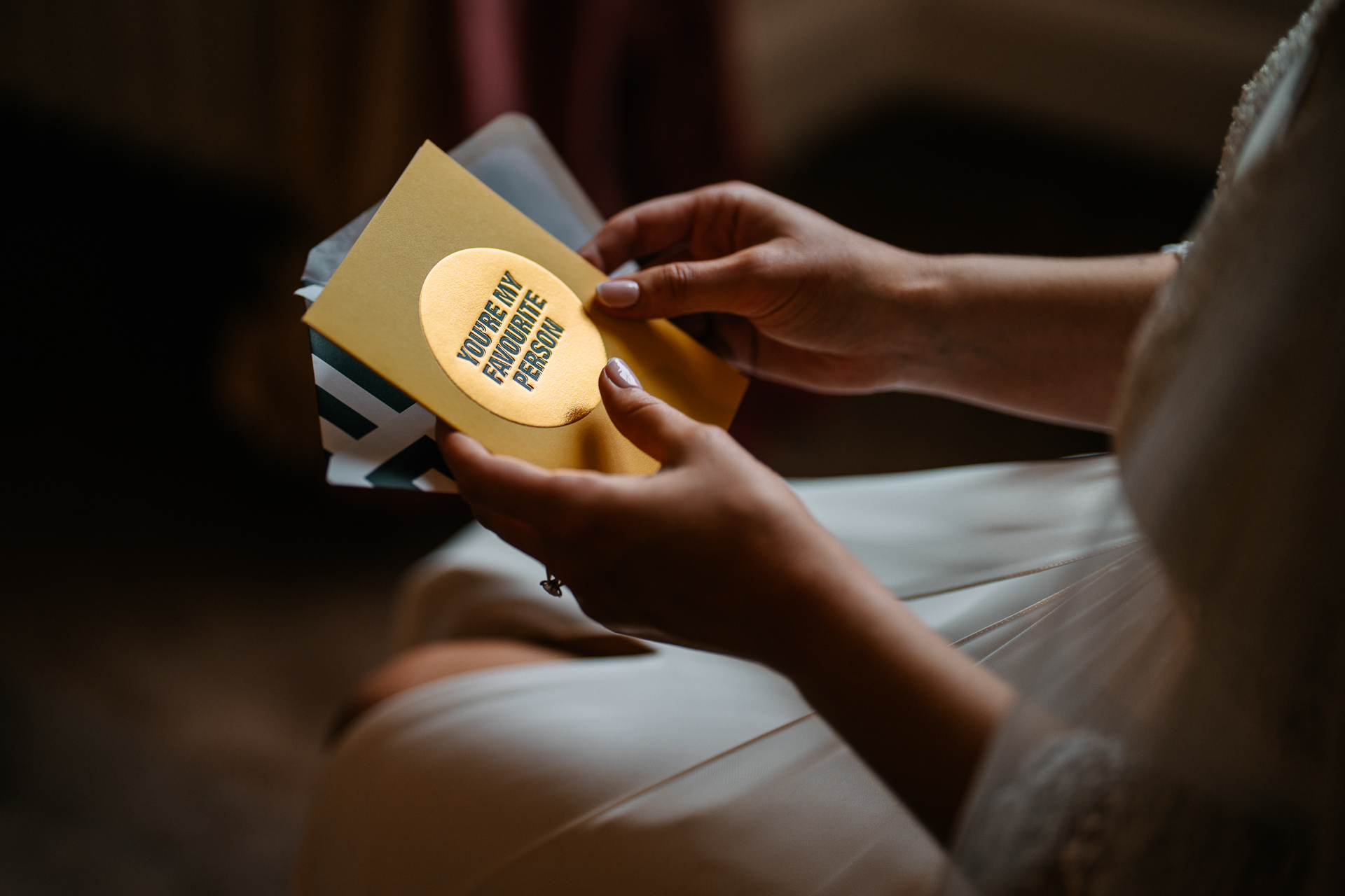 A person holding a yellow and white object