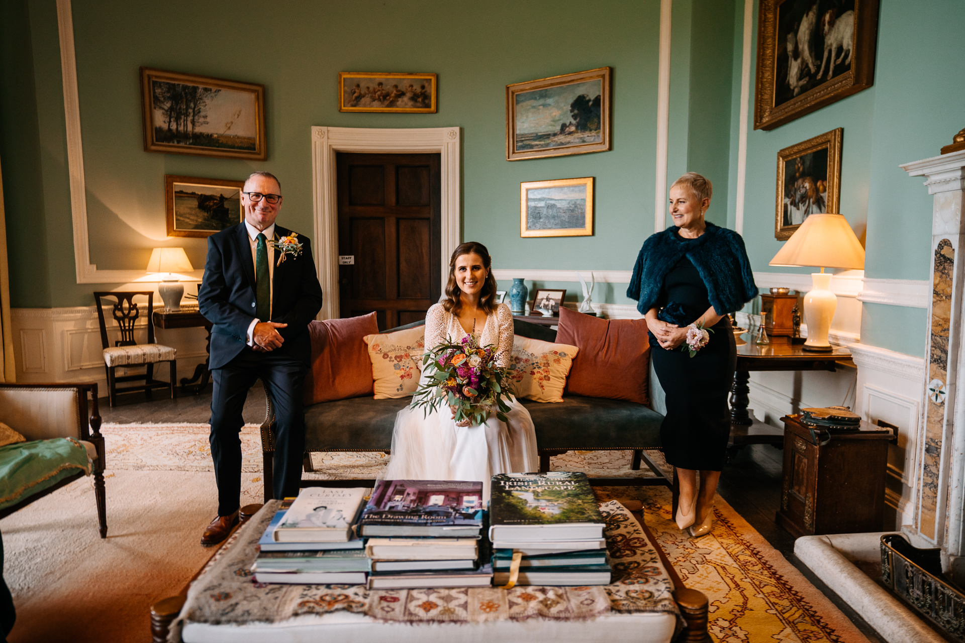 A group of people posing for a photo in a living room