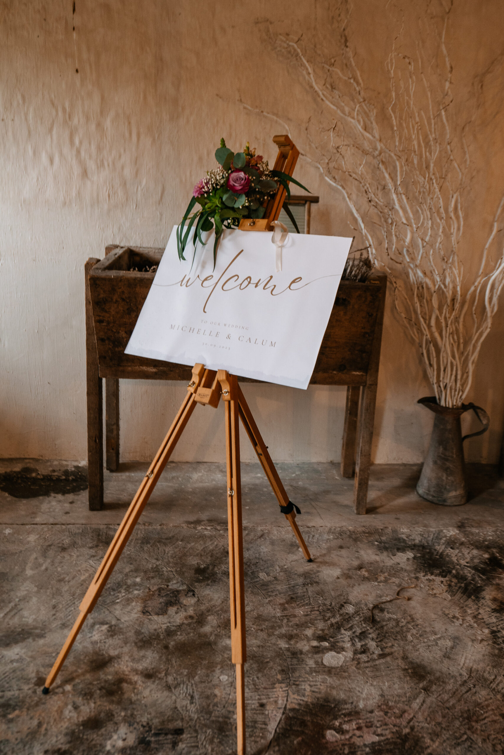 A easel with flowers on it