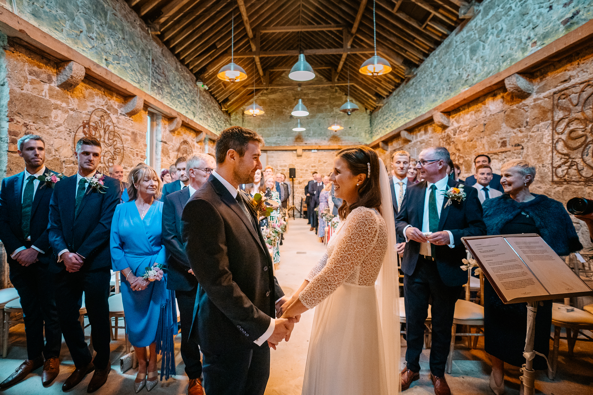 A man and woman dancing in a room with a group of people