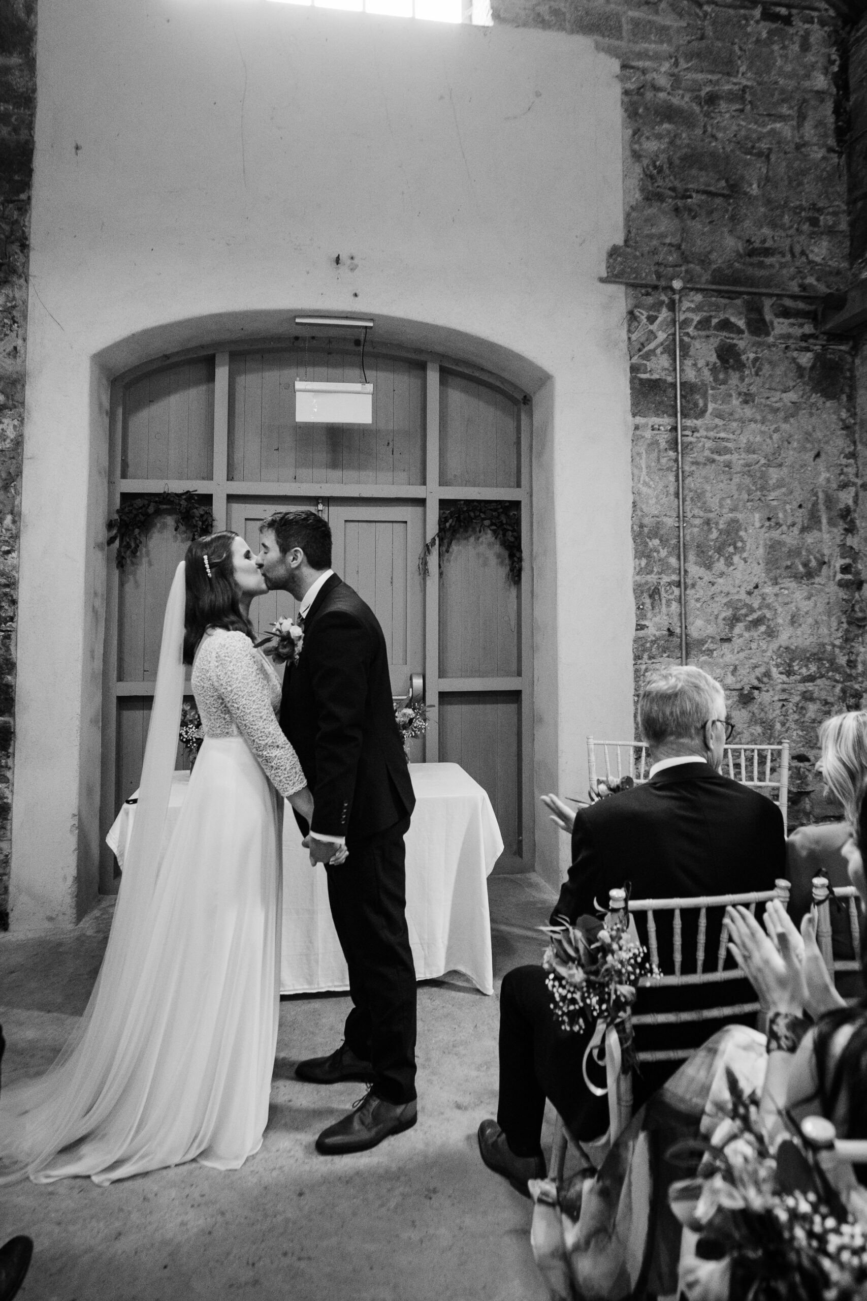 A bride and groom kissing