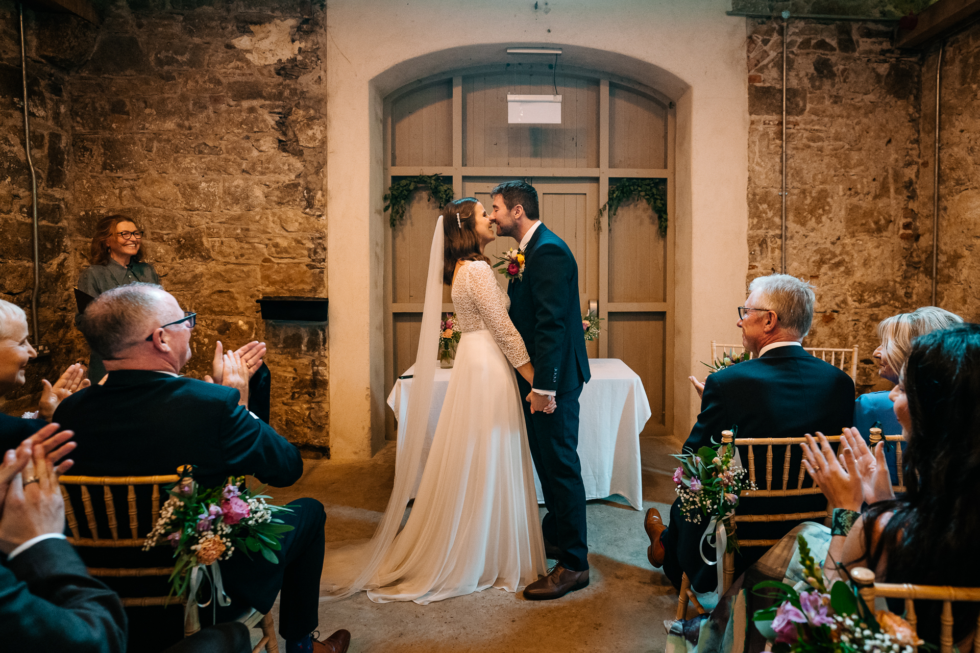 A bride and groom walking down the aisle