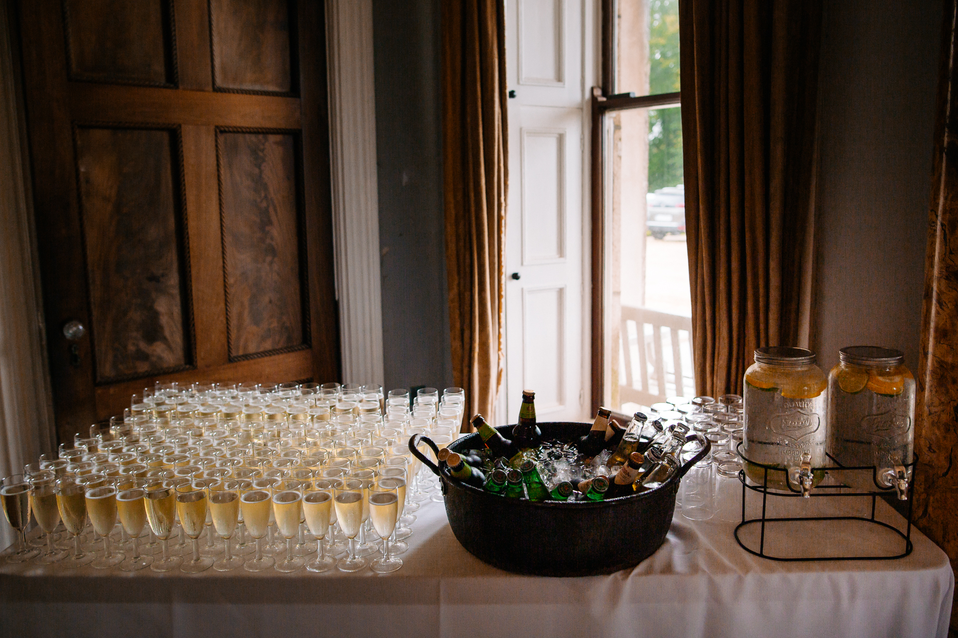 A table with glasses and bottles on it