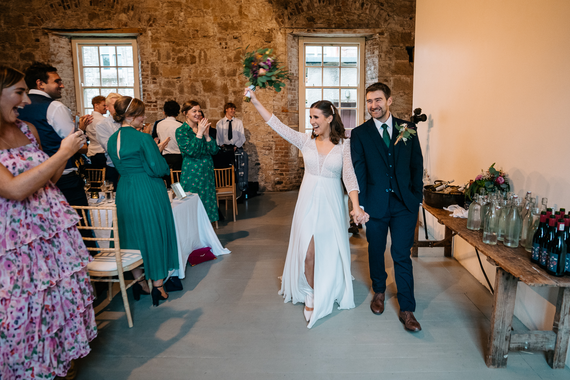 A man and woman dancing in a room with a group of people