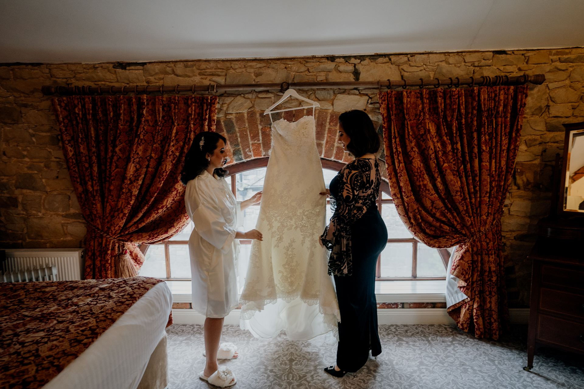 A person holding a white dress