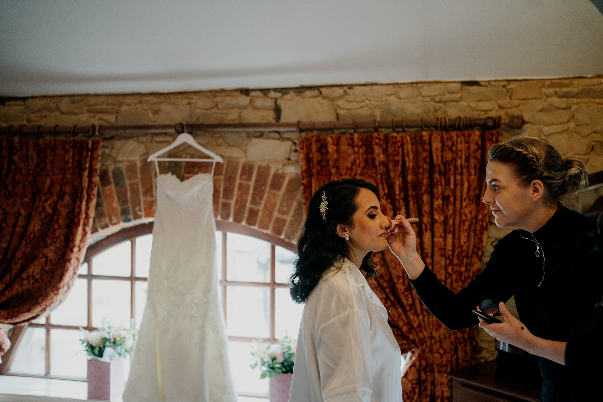 A woman and a man looking at a phone