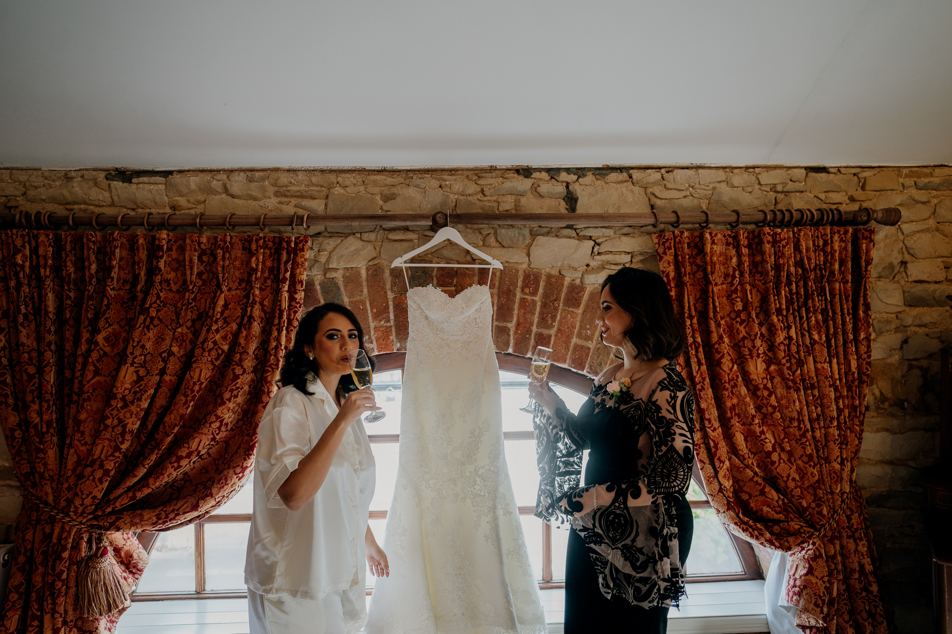 A couple of women in white dresses