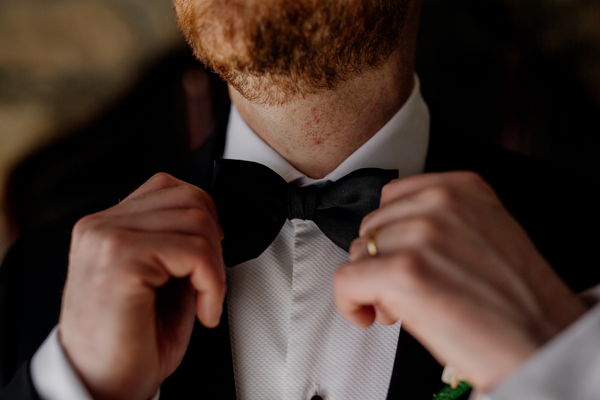 A man adjusting his tie