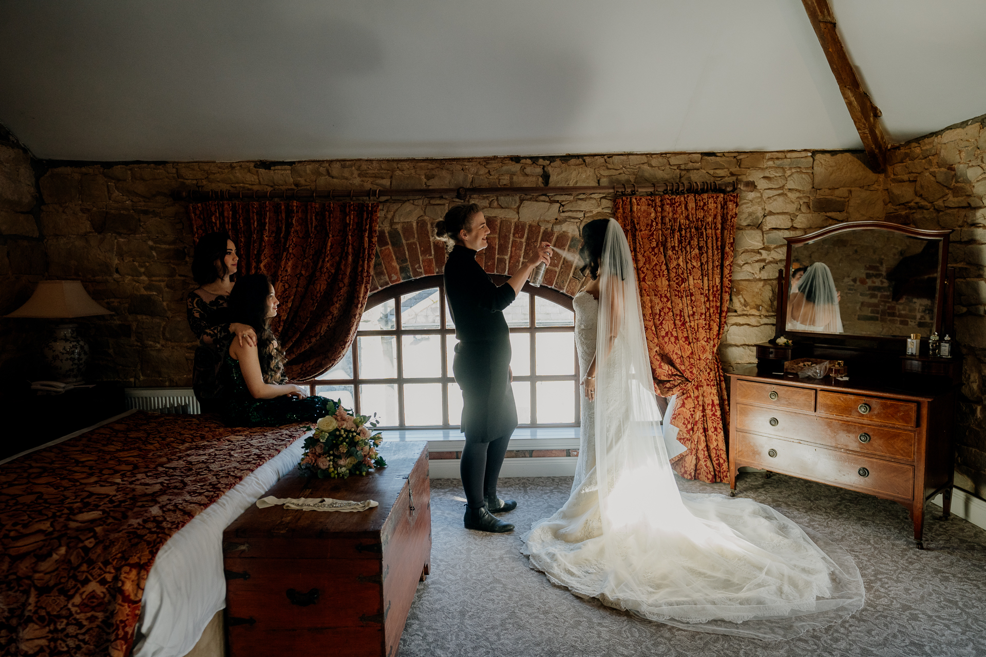 A man and woman dancing in a room with a fireplace