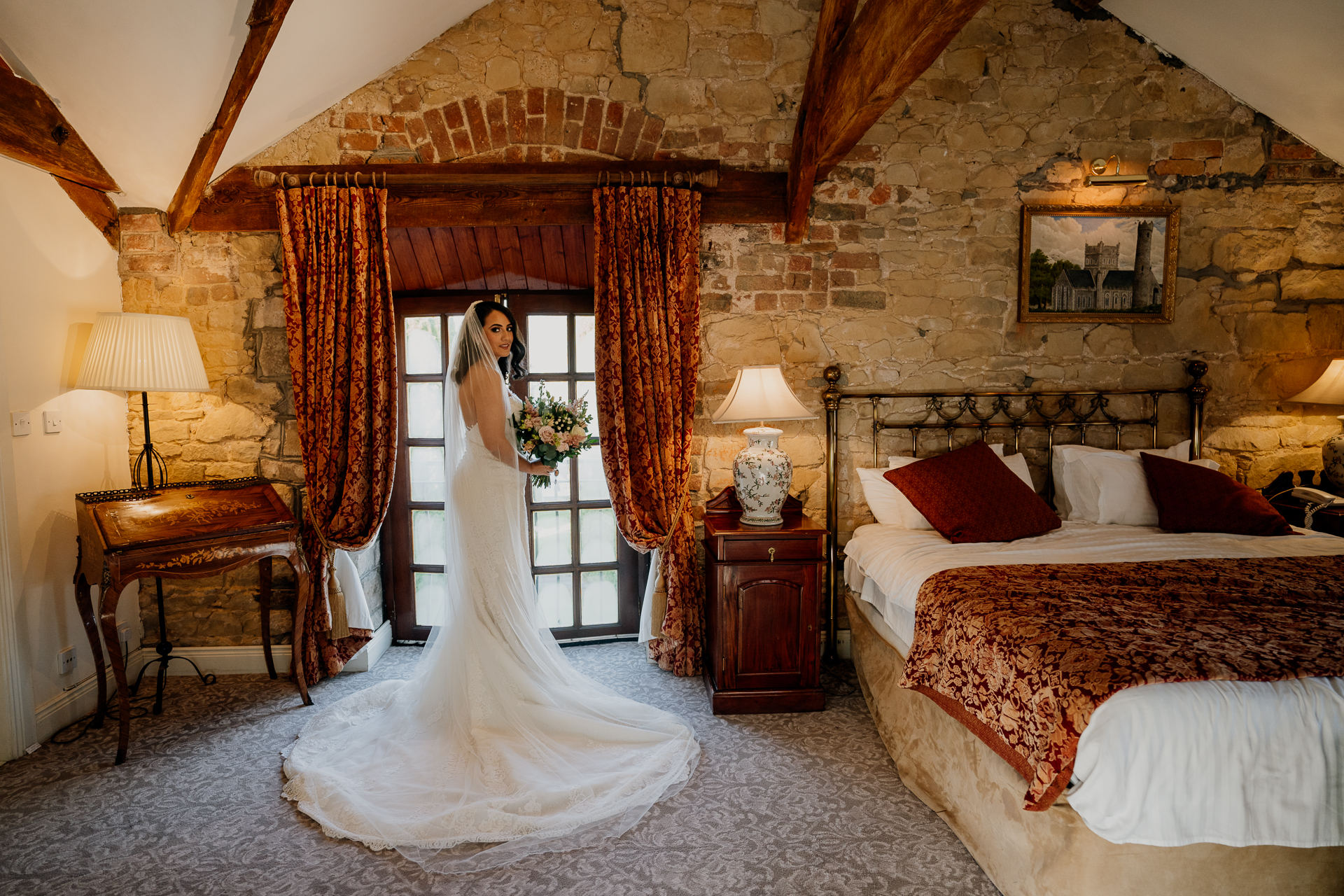 A person in a wedding dress in a bedroom