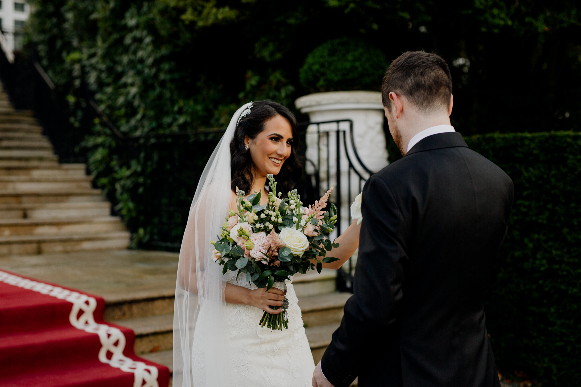 A man and woman holding flowers