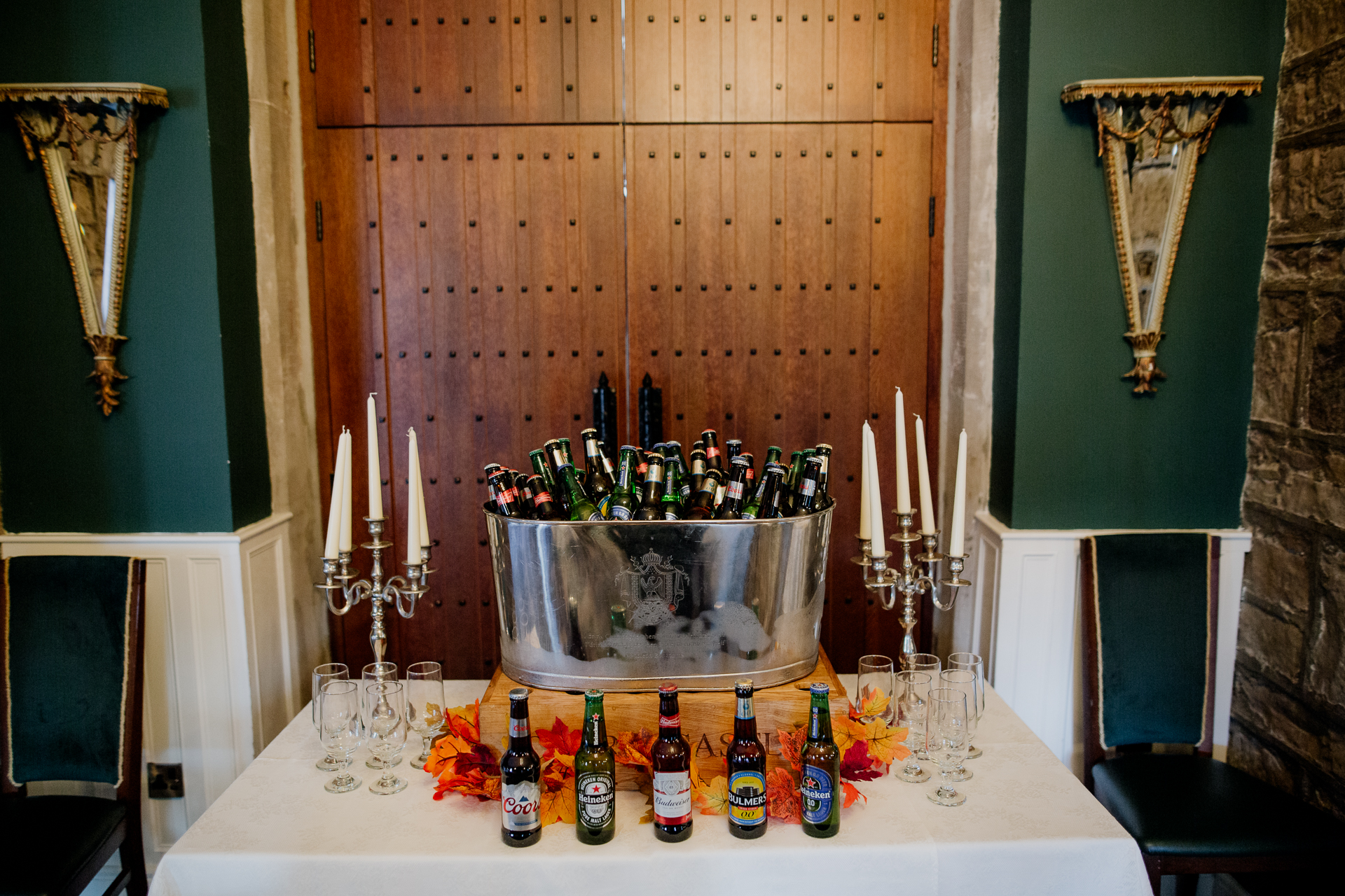 A table with bottles and glasses on it