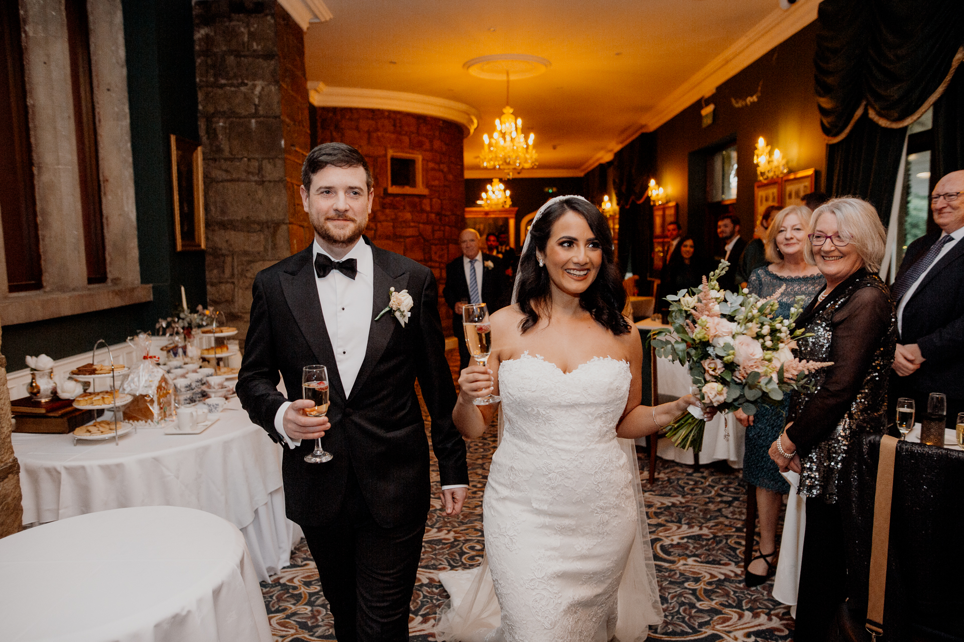 A man and woman holding wine glasses