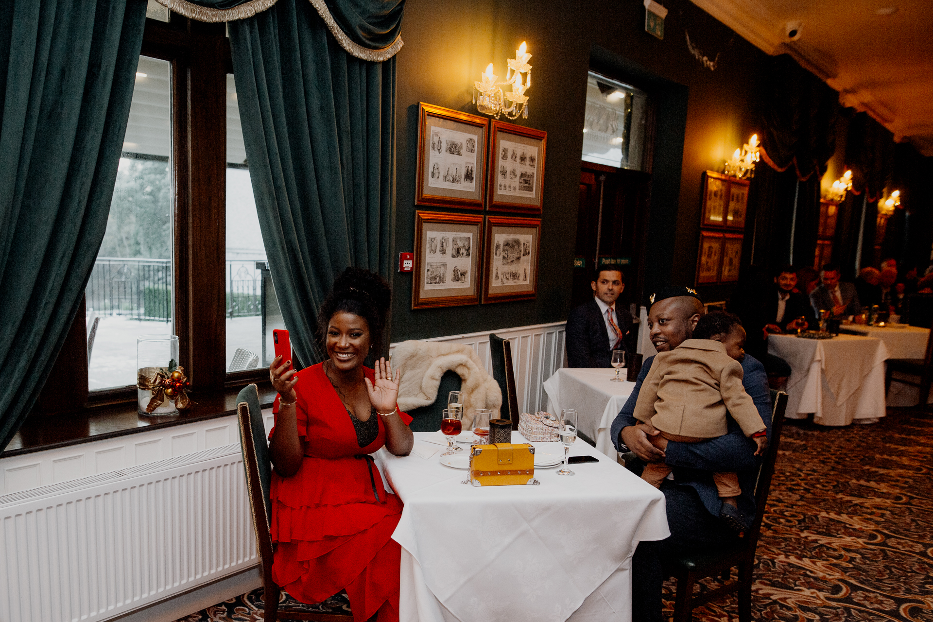 A woman standing next to a table