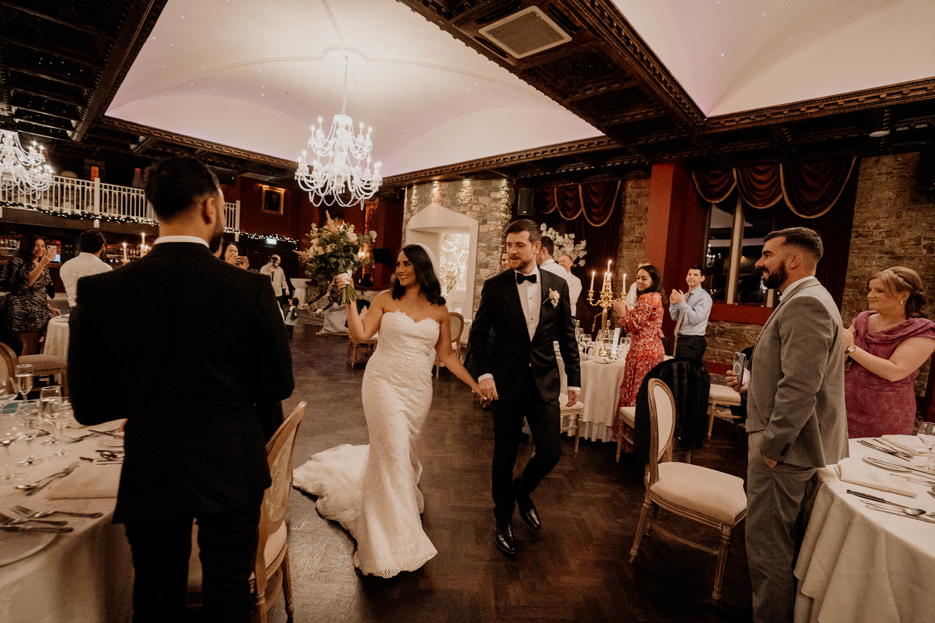 A bride and groom walking down the aisle