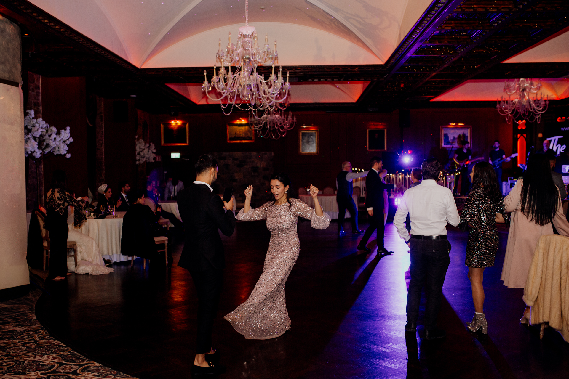 A man and woman dancing at a wedding reception