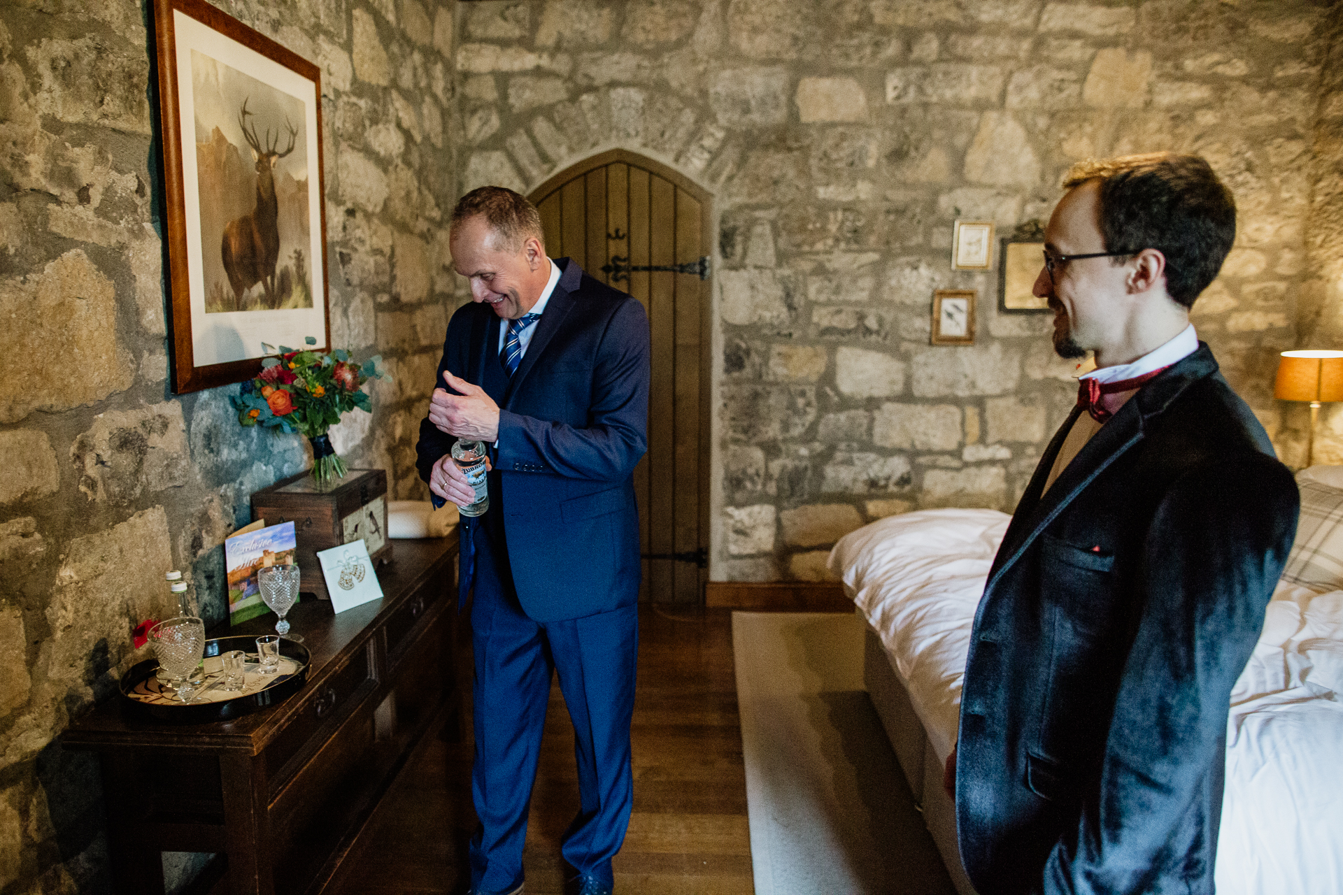 A man in a suit talking to another man in a suit