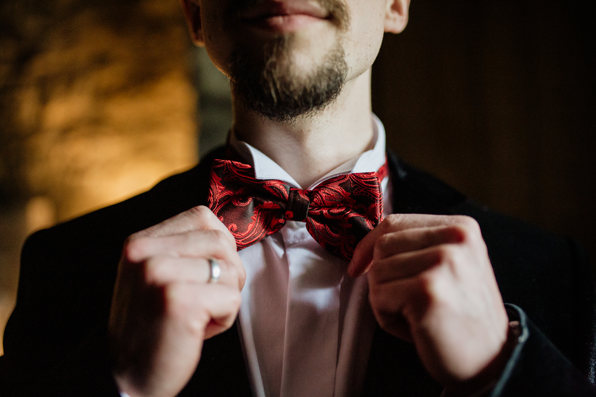 A man in a suit and bow tie