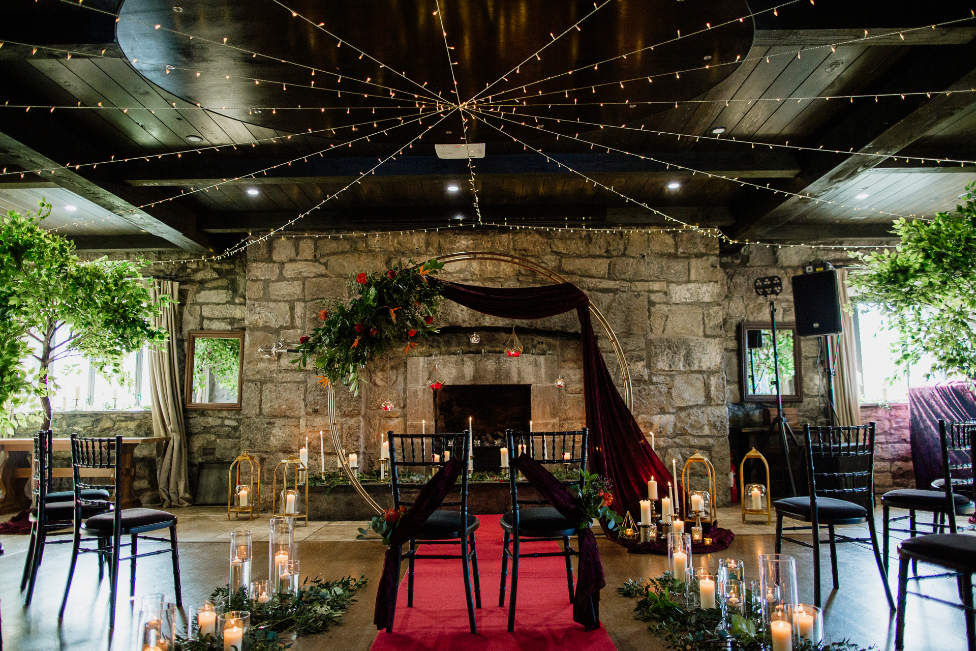 A room with a fireplace and chairs