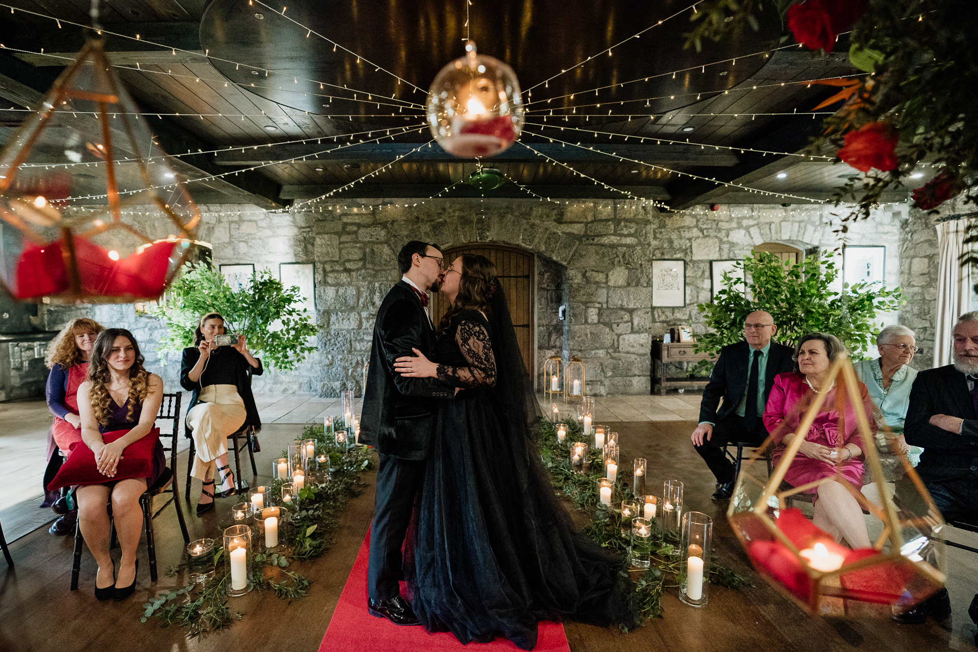 A man and woman dancing in a room with a group of people