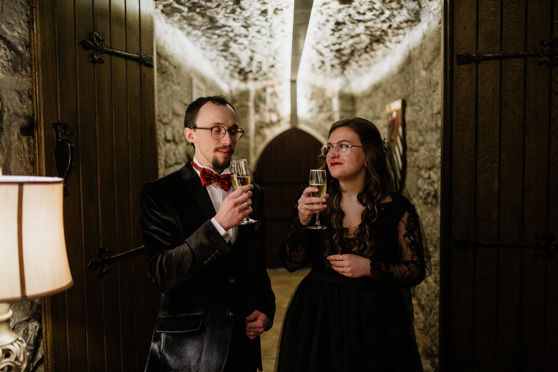 A man and woman holding wine glasses