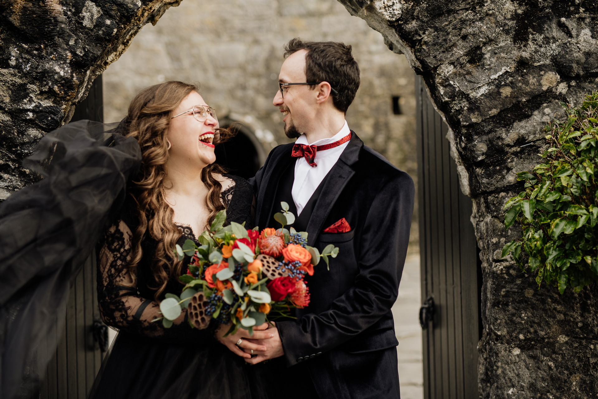 A man and woman holding flowers