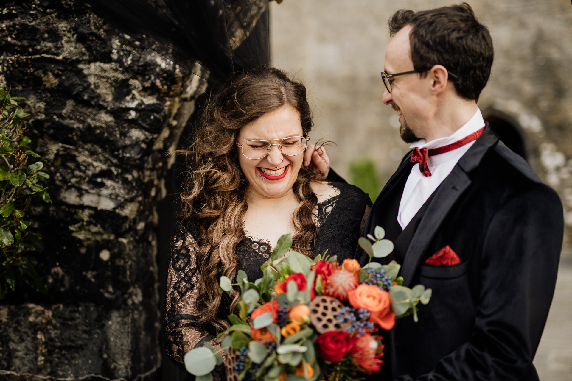 A man and woman holding flowers