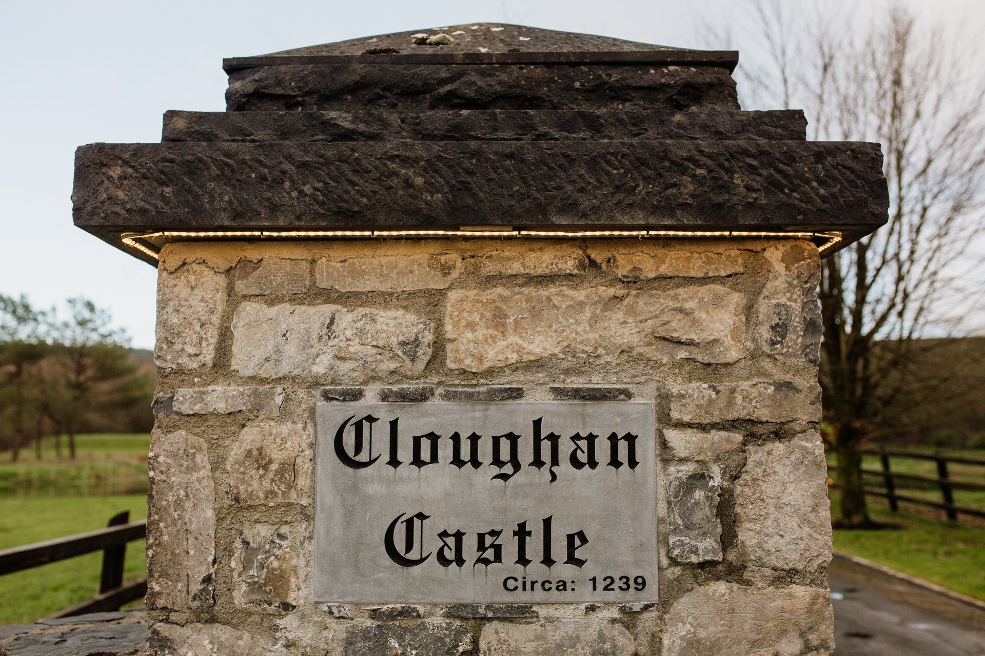 A stone structure with a sign on it