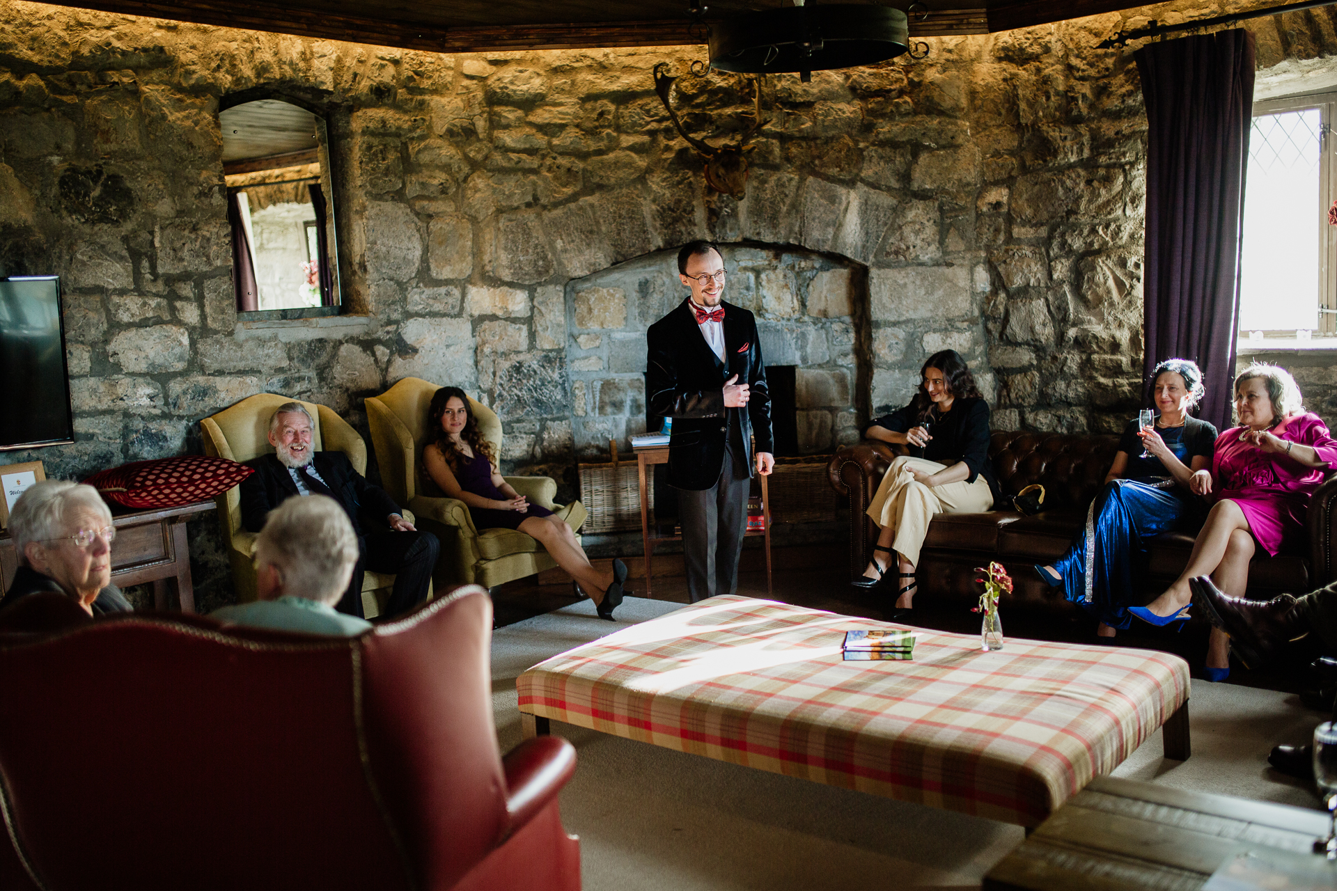 A person standing in front of a group of people sitting in chairs