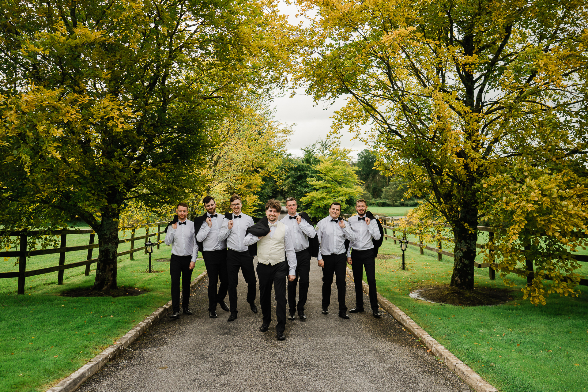 A group of people walking on a path in a park