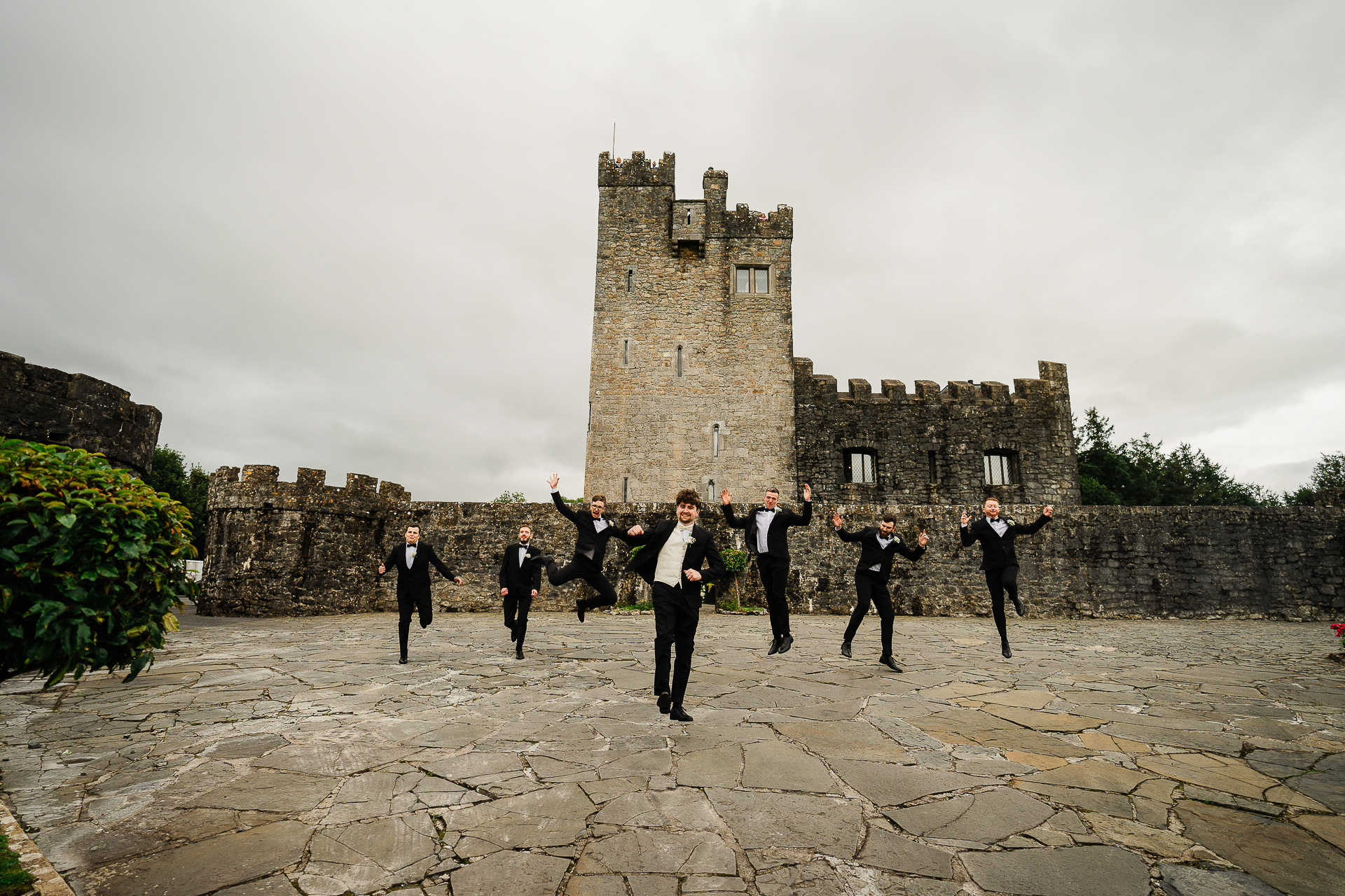 A group of people in front of a castle