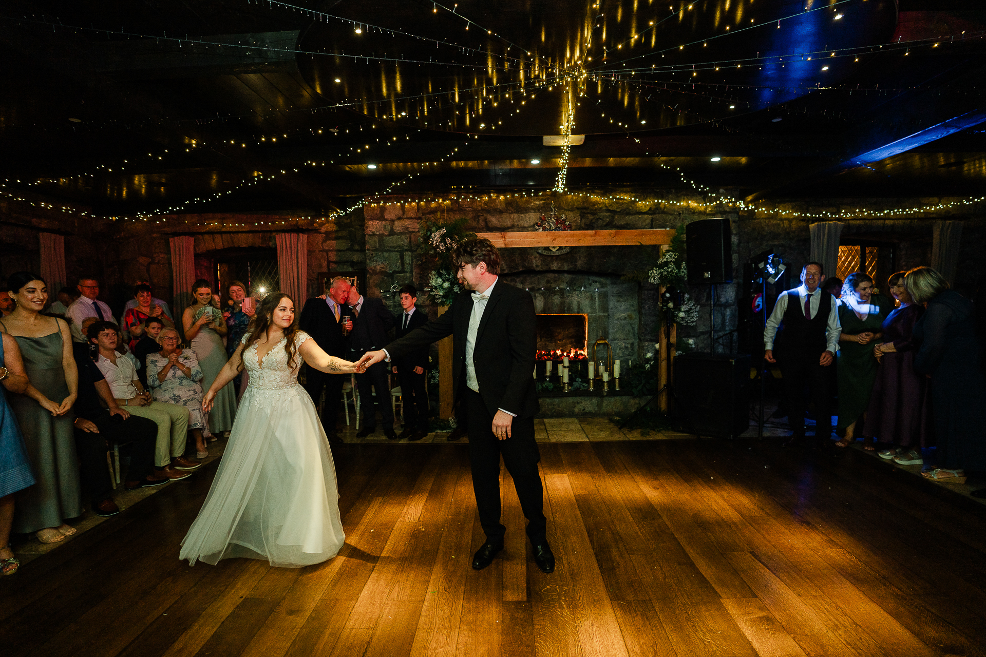 A man and woman dancing at a wedding reception