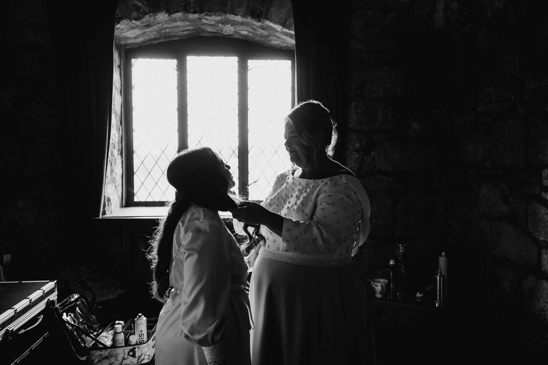 A person and a child looking out a window