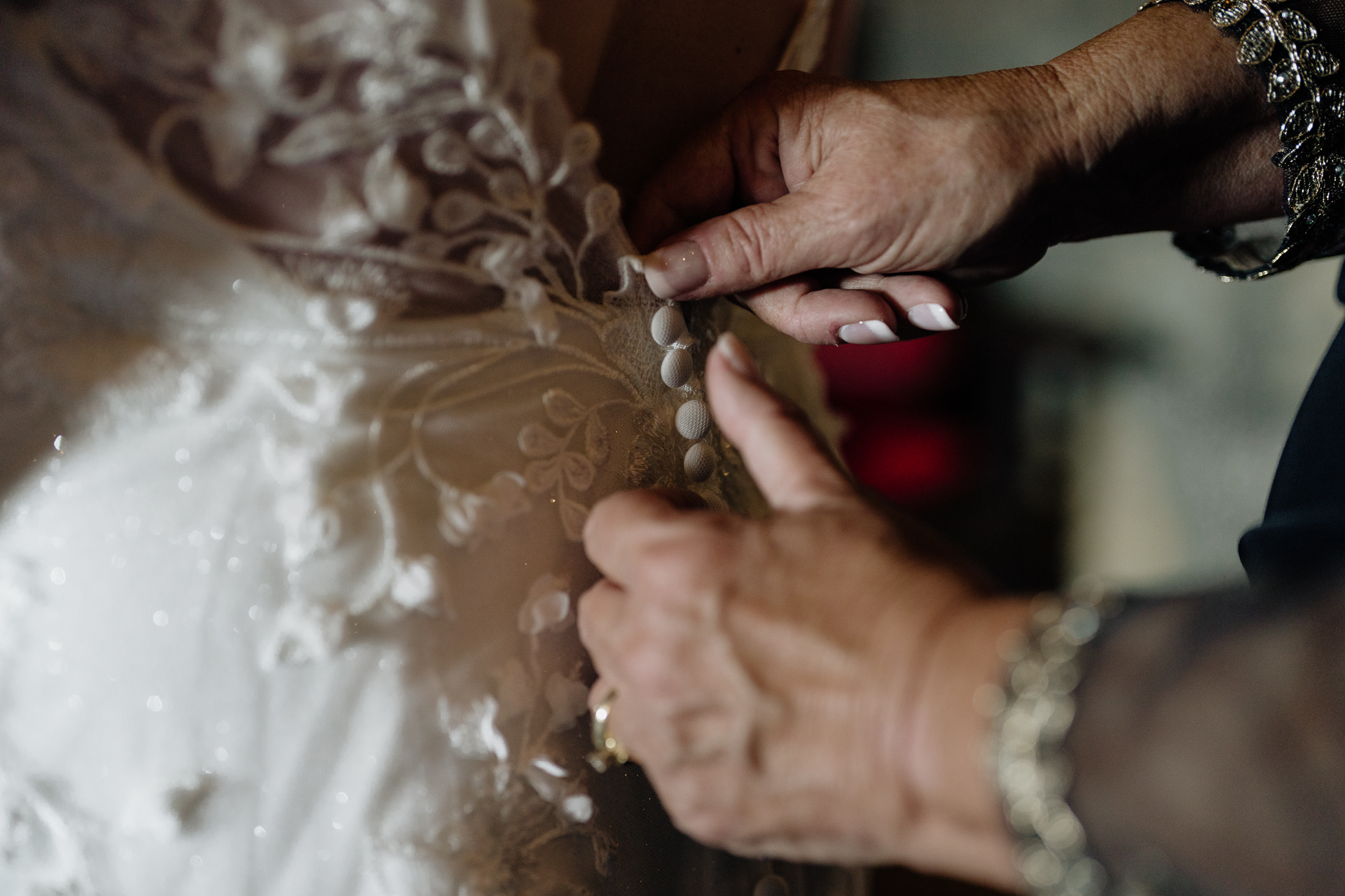 A person cutting a piece of cake