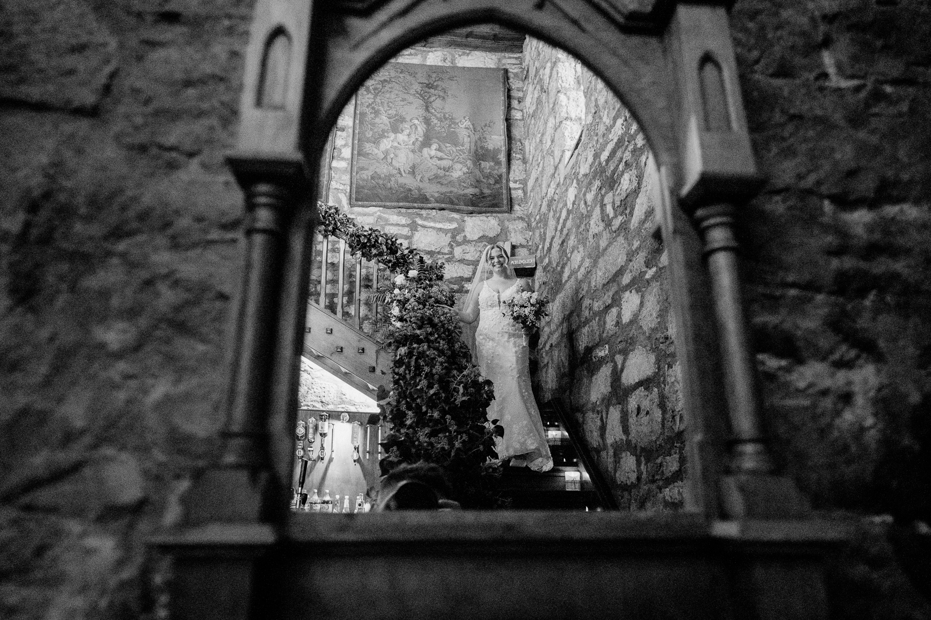 A bride and groom in a window