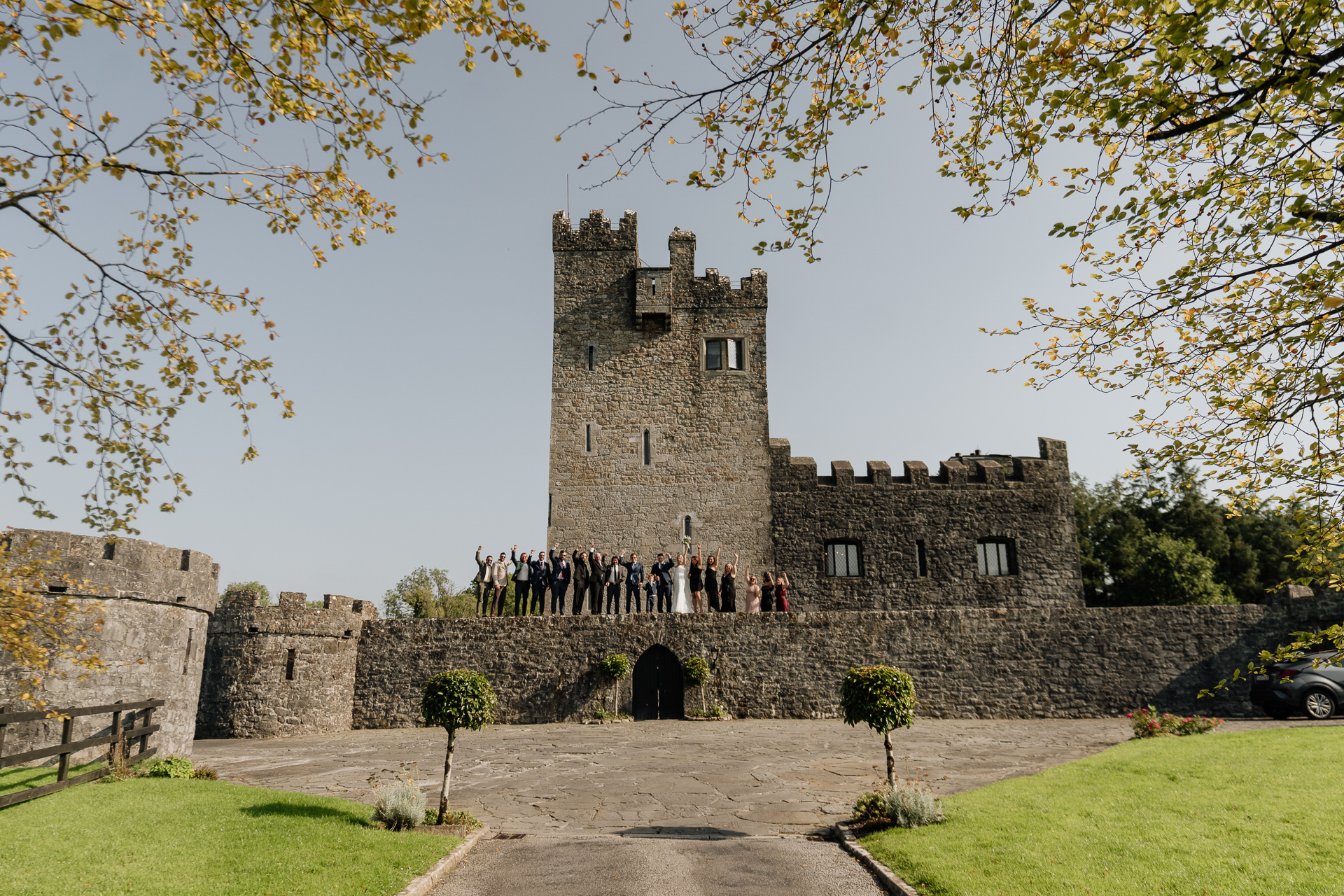 A stone castle with a stone wall and a road